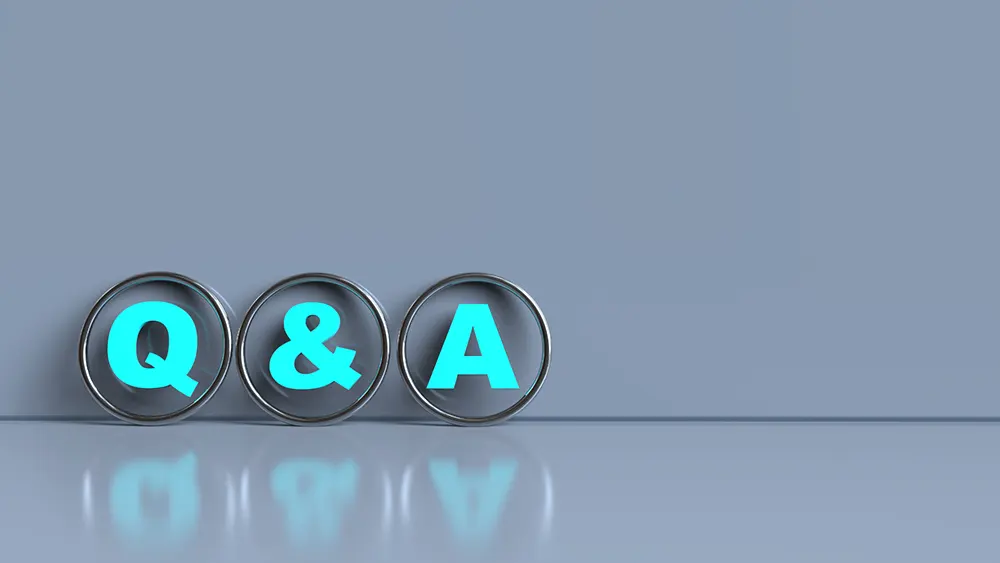 What Do Mold Spores Look Like - A Blue-Gray Background with a Q and An A in Metal Ring.
