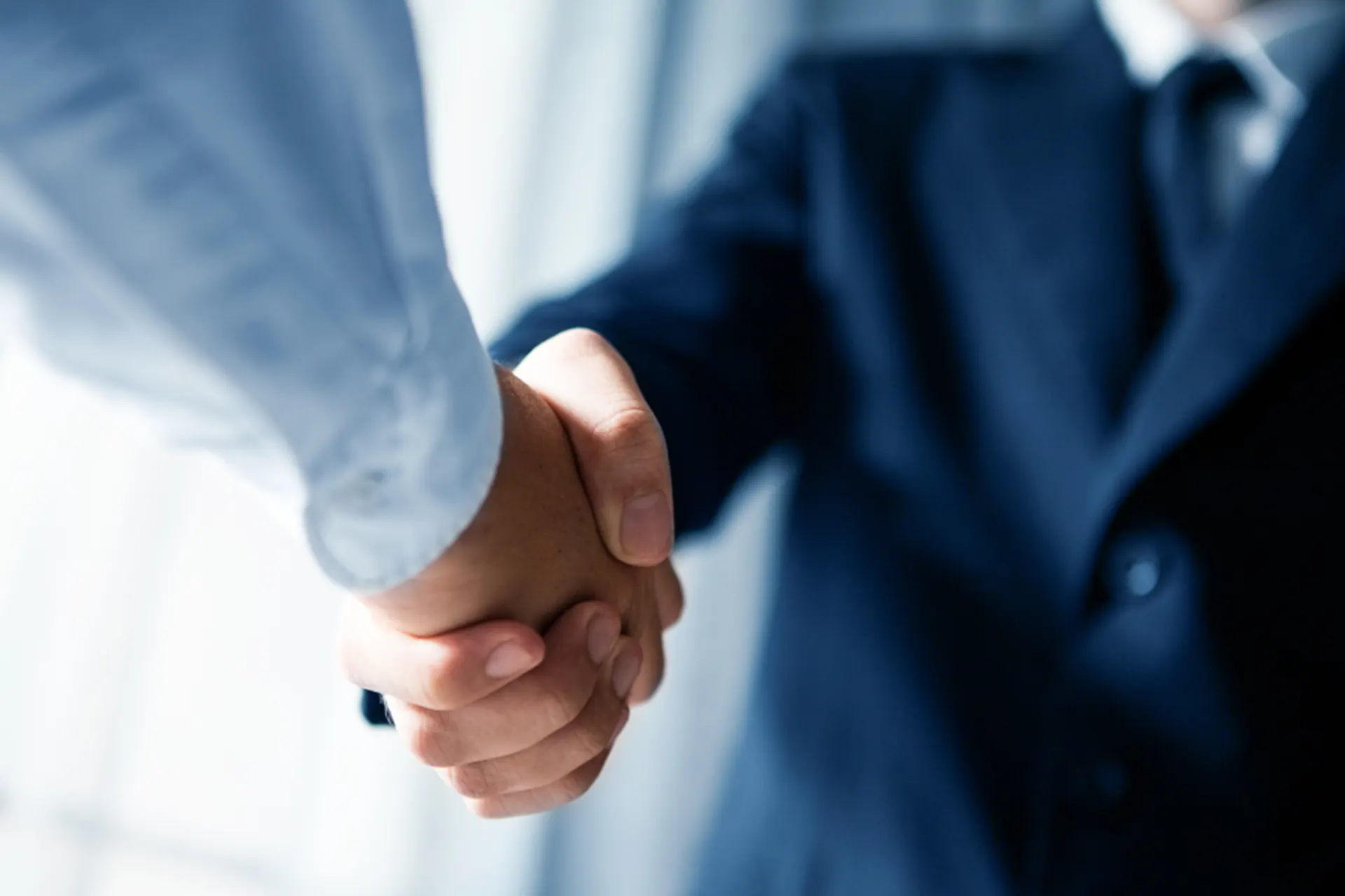 Basement Mold Remediation Services for New York - A Contractor and a Homeowner Shaking Hands