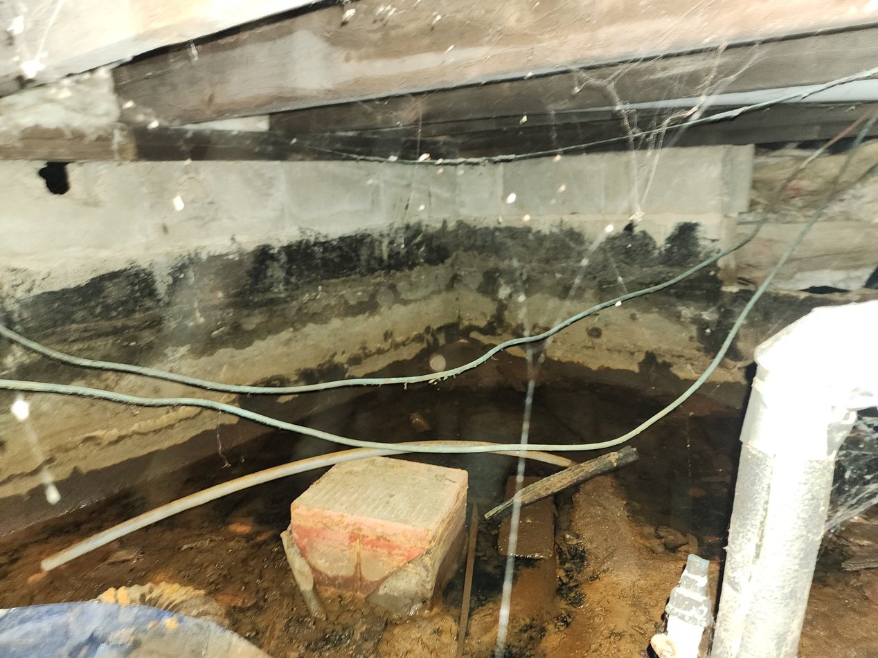 Can Mold Grow on Concrete? A Picture of a Wet Concrete Foundation
