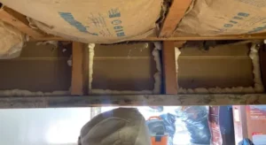 Rim Joist Insulation - A Rim Joist in a Crawl Space with Spray Foam Insulation Applied